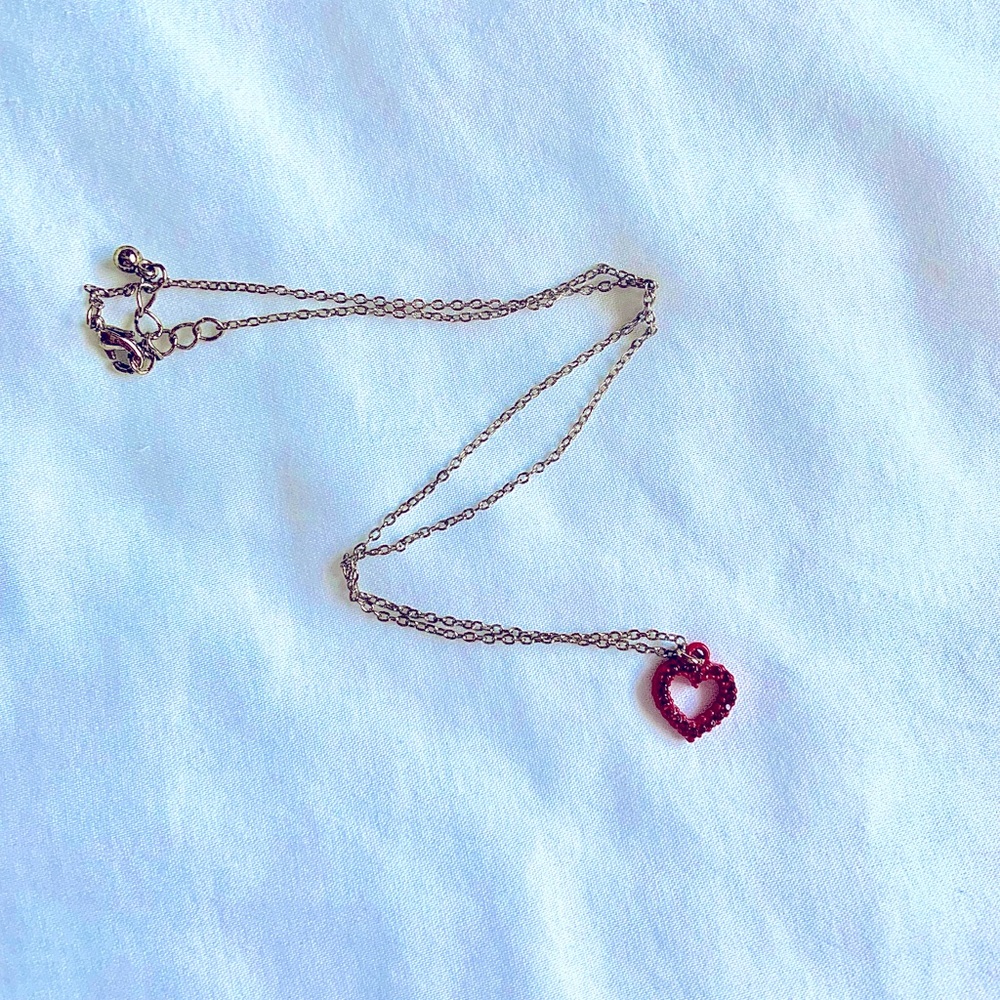 Red heart necklace on gold chain